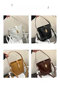 Detail showing four leather bucket bags in white, black, khaki, and brown with gold locks