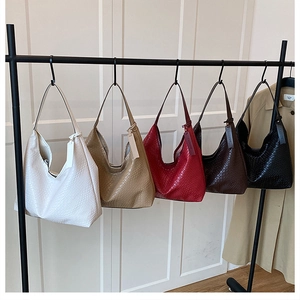 Selection of retro hobo bags with woven texture and wide shoulder straps in five colors