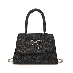 Sac à main noir scintillant à paillettes avec nœud argenté et bandoulière en chaîne