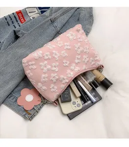 Pink floral embroidery makeup bag with large capacity and cute flower charm detail
