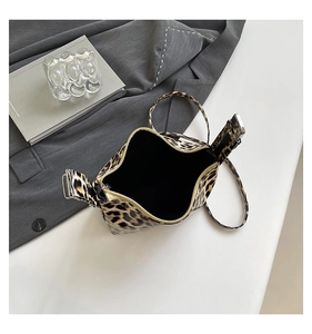 Top view of leopard print tote bag with gold zipper detail and spacious black interior