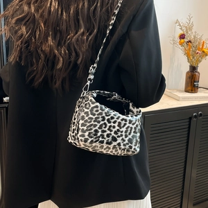 Chic leopard print crossbody bag with adjustable strap and sleek hobo shape for women