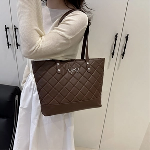 Quilted dark brown tote bag with metal bow detail, large shoulder bag for women
