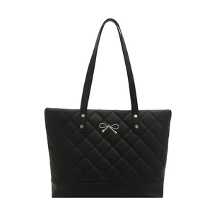 Black quilted tote bag with silver bow hardware and large capacity shoulder straps