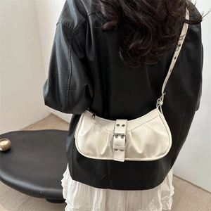 Chic beige glossy leather underarm bag with silver buckle and stylish pleated detail