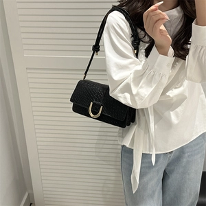 French style black underarm bag with crocodile texture and gold horseshoe buckle