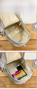 Detailed view of large butterfly backpack interior with laptop sleeve and pockets