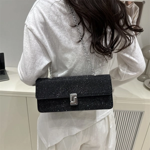 Sparkly black sequin baguette bag with silver chain strap and S-shaped metal buckle