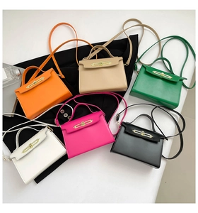 Selection of stylish trapezoid handbags in six vibrant colors with gold metal locks