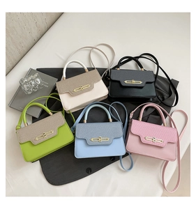 Flat lay of colorful crossbody square bags in pastel leather finishes with gold locks