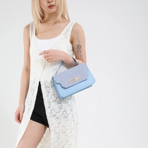 Light blue crossbody bag for women with gold twist lock and striped fabric flap