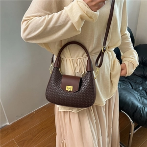 Fashionable dark brown crescent woven handbag with gold buckle and adjustable strap