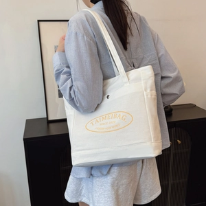 White canvas tote bag with large capacity and logo for daily casual commuting