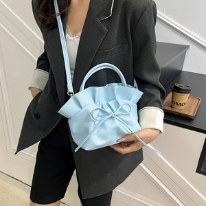Light blue ruched cloud handbag for women with bow detail and adjustable shoulder strap