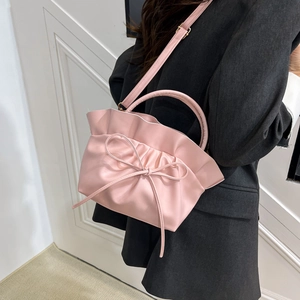 Pink pleated cloud bag for women with elegant bow detail and round top handle
