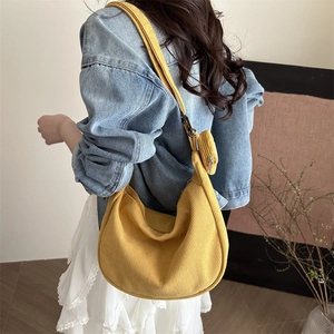 Yellow corduroy hobo shoulder bag with crescent shape and matching mini coin purse pouch