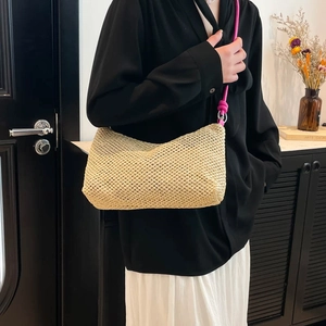 Chic beige straw tote bag with vibrant fuchsia rope strap for a summer casual look