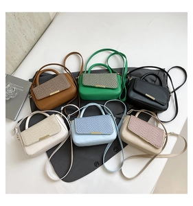 Close-up of herringbone texture flap bags in six colors with gold metal clasps
