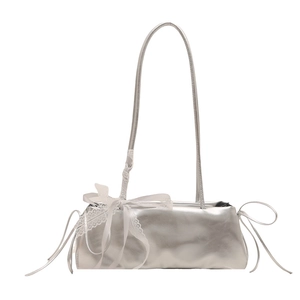 Silver metallic shoulder bag with white lace trim and ribbon bow for elegant women