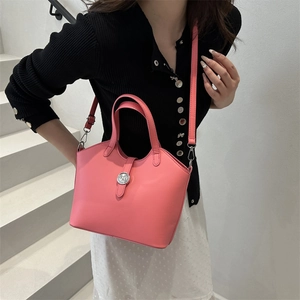 Pink minimalist tote bucket bag with adjustable strap and silver metal twist lock