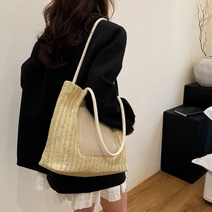 Minimalist straw woven tote bag with cotton rope straps and leather patch for summer