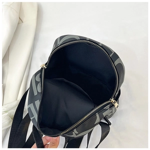 Top view of leather backpack with letter print, golden zipper, and spacious interior