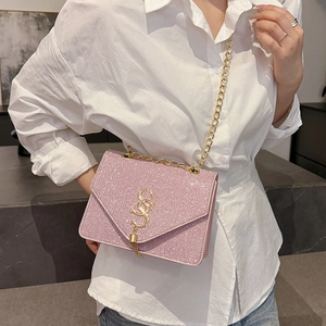 Pink sequin crossbody bag with gold chain strap and interlocking metal logo for women