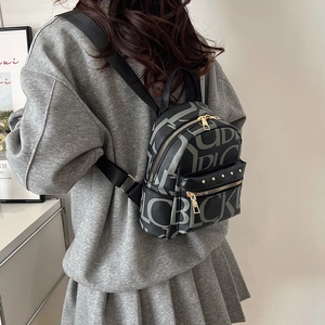 Retro monogram mini backpack with gold zippers and stylish rivets for women's daily commute