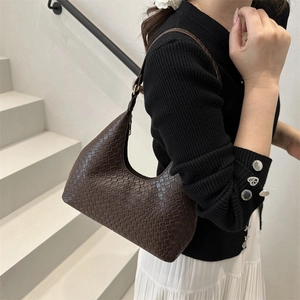 Minimalist dark brown woven hobo underarm bag with sleek leather shoulder strap