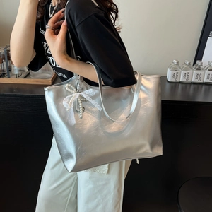 Large silver tote bag with lace bow and pearl charm for casual daily commuting