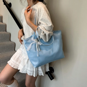 Large light blue tote bag with white lace bow and pearl pendant for daily commuting