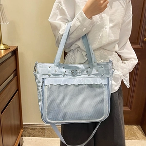 Light blue minimalist tote bag with heart metal buckle, mesh pocket and double handles