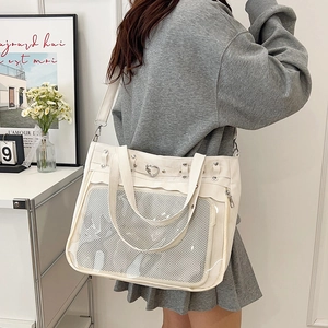 Minimalist off-white canvas ita bag with transparent PVC window and heart rivets