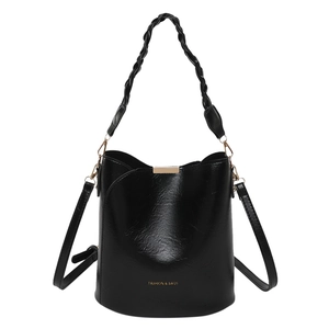 Chic black bucket bag with braided handle and adjustable shoulder strap for women