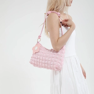 Pink popcorn texture shoulder bag for women with floral charm for casual summer style