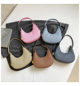 Detailed close-up showing various colors and textured fabric of the hobo shoulder bag