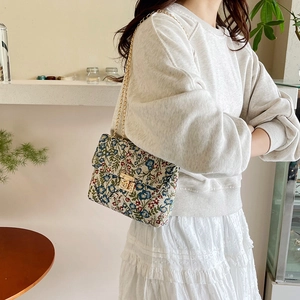French vintage floral crossbody bag with gold chain strap and textured jacquard fabric