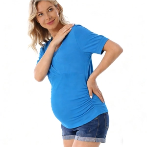 Detail of light blue maternity nursing top with V-neck cross design and side ruching