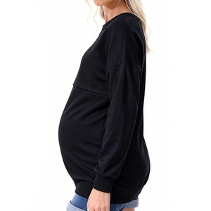 Side view of oversized black maternity sweatshirt showing loose fit for pregnancy comfort