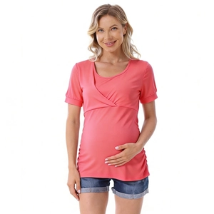 Detail of pink maternity breastfeeding top with cross-front design and side ruching