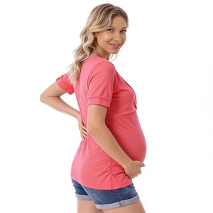 Close-up of pink maternity top featuring side ruched details and soft modal fabric