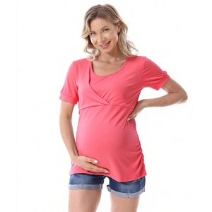 Detail of coral pink maternity top showing the practical nursing layer and side ruching