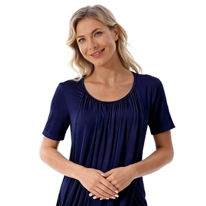 Detail of soft pleated modal fabric on a navy blue short-sleeve maternity dress