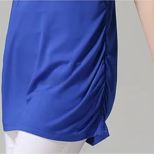 Detail shot of the adjustable side ruching on a royal blue maternity nursing top