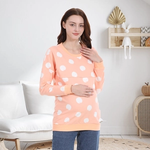 Detail of concealed nursing zipper on peach-pink cotton sweatshirt with apple print
