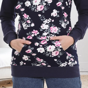 Close-up of floral print maternity hoodie with kangaroo pocket and ribbed cuffs