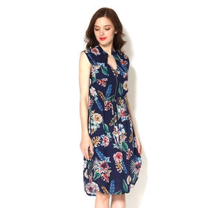 Detail of navy blue floral maternity dress featuring adjustable waist tie and zip neckline