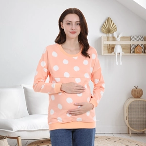 Close-up of pink polka dot maternity nursing sweatshirt with hidden breastfeeding openings