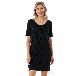 Close-up of elegant asymmetrical side pleats on a soft modal black maternity dress