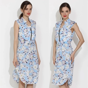 Detail of light blue floral dress showing lapel collar, contrast zipper and drawstring waist